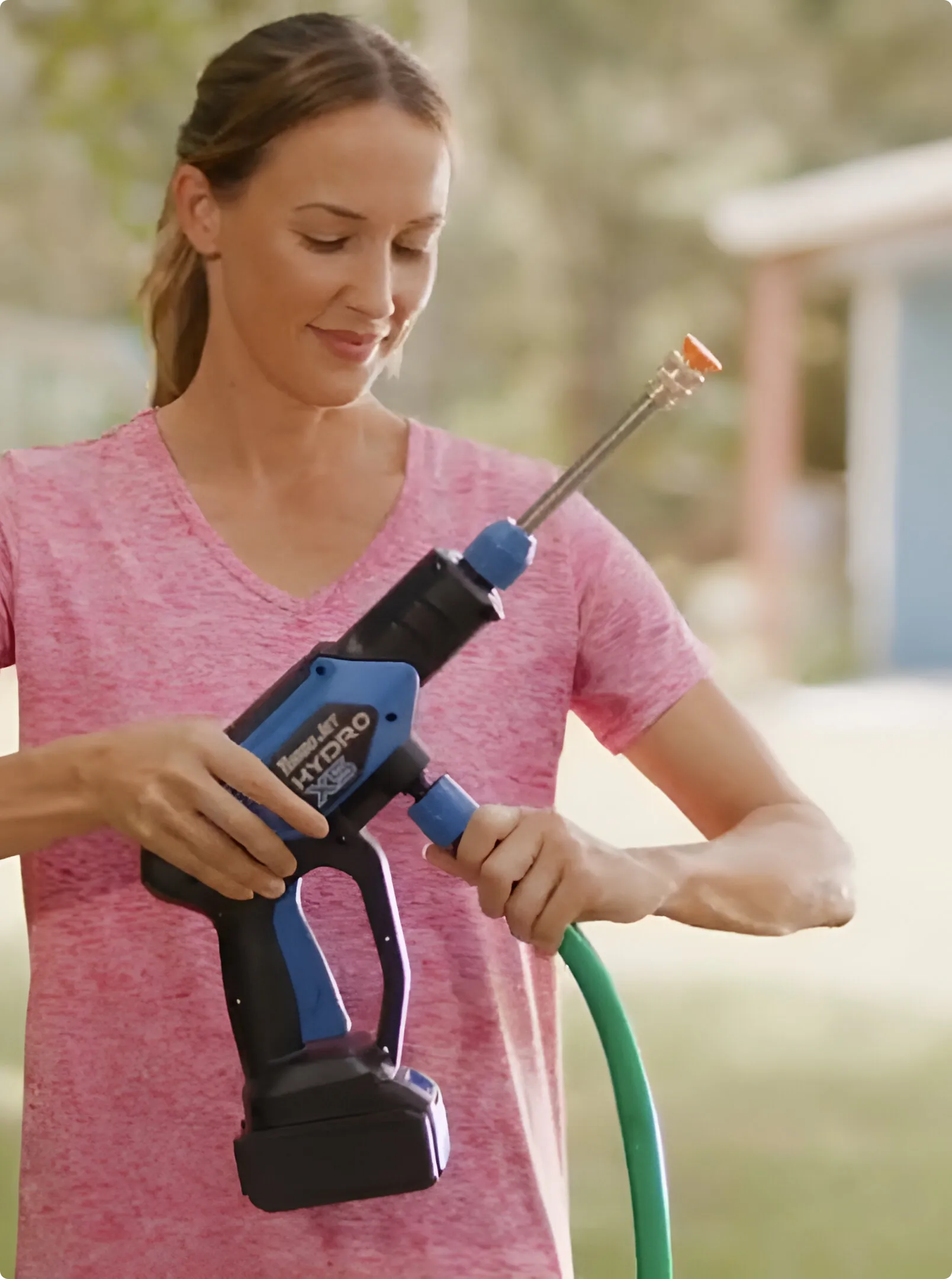 customer using hydro x5 pressure washer